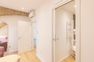 a room with a door leading to a bedroom at Center Boutique in Cagliari