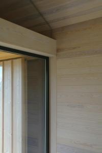 a window on the side of a house at Cabin Overlooking Hallingskarvet National Park in Geilo
