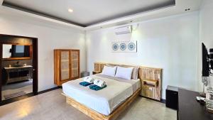 Postel nebo postele na pokoji v ubytování Kies Villas Lombok