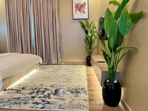 Una cama o camas en una habitación de Timmyshortlets
