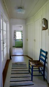 a living room with a bench and a window at Cabin With Sunset Views And Private Dock in Sandefjord +31 photos