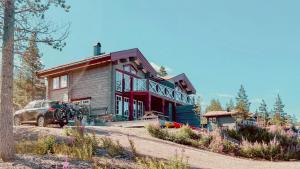a house with a car parked in front of it at Mountain-Close Cabin With Panoramic View in Sälen