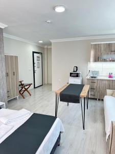 a room with two beds and a kitchen at Upart Flats by REFE in Antalya +88 photos