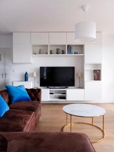 TV a/nebo společenská místnost v ubytování Le Panoramique