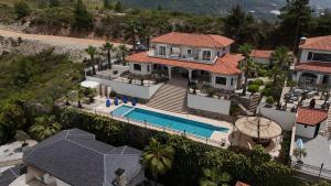 an aerial view of a house with a swimming pool at Great Villa with beatiful view and 4 bedrooms more 1000 sqm AREA in Alanya