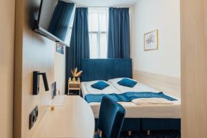 Postel nebo postele na pokoji v ubytování Steens Hotel Alster City