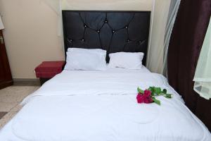 Postel nebo postele na pokoji v ubytování Ununio Beach Holiday Home