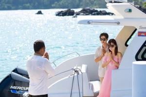 a man and a woman on a boat at Mafiya Resort in Koh Rong Island