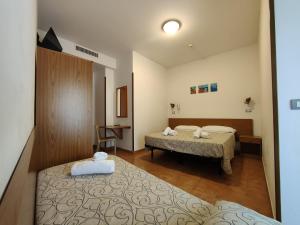 Postel nebo postele na pokoji v ubytování Hotel Anna