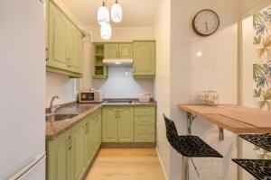 Kuchyň nebo kuchyňský kout v ubytování Casa Calma Zona Hospital