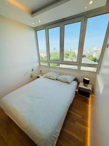 En eller flere senge i et værelse på Appartement Vicat Porte de Versailles