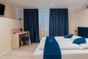 Postel nebo postele na pokoji v ubytování Steens Hotel Alster City