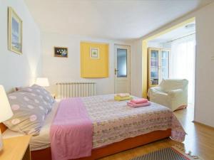 Postel nebo postele na pokoji v ubytování Apartments Sunce