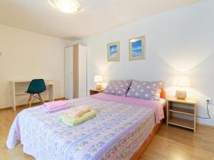 Postel nebo postele na pokoji v ubytování Apartments Sunce