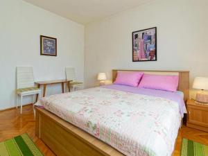 Postel nebo postele na pokoji v ubytování Apartments Sunce