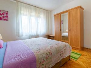 Postel nebo postele na pokoji v ubytování Apartments Sunce