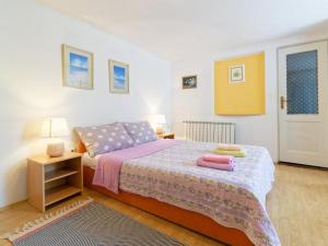Postel nebo postele na pokoji v ubytování Apartments Sunce