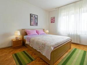 Postel nebo postele na pokoji v ubytování Apartments Sunce