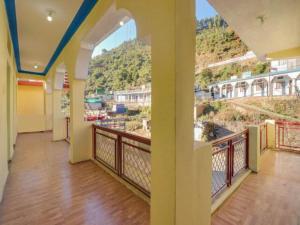 a balcony with a view of a mountain at Hotel Abhinandan in Phata