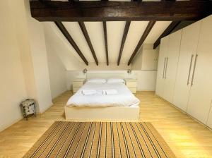 A bed or beds in a room at Duplex al lado de los Jardines del Turia