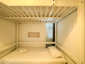 A bed or beds in a room at Duplex al lado de los Jardines del Turia