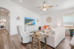 a living room with a couch and a table at Breeze Easy home in Crystal Beach