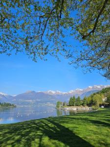 a view of a lake with mountains in the background at Gigi's House in Colico