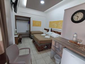 Katil atau katil-katil dalam bilik di Villa Nektaria
