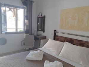 Katil atau katil-katil dalam bilik di Villa Nektaria