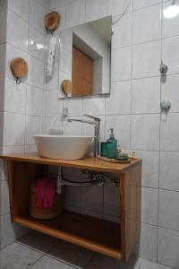 a bathroom with a sink and a mirror at Apartments Krnjic in Umag +24 photos