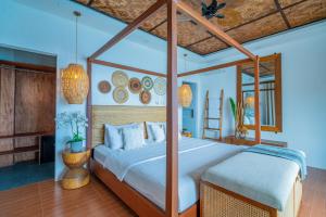 Postel nebo postele na pokoji v ubytování Pearl Bay Villas Private Resort + 37 fotografií
