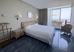 Tempat tidur dalam kamar di Holiday Club Jardin Amadores
