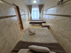 a hospital room with two beds and a shower at Dream Apartments in Kyiv +57 photos