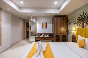 Postel nebo postele na pokoji v ubytování Hotel Classique, Rajkot