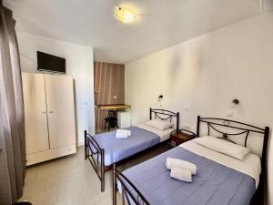 Uma cama ou camas num quarto em Villa Dima