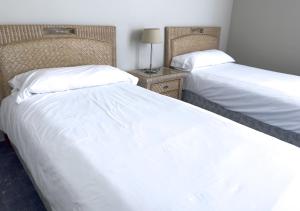 Tempat tidur dalam kamar di Holiday Club Jardin Amadores