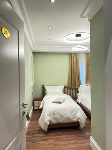 Postel nebo postele na pokoji v ubytování Flored Hotel