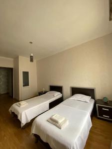 Postel nebo postele na pokoji v ubytování Guest-House Mimino