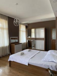 Postel nebo postele na pokoji v ubytování Guest-House Mimino
