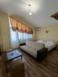 Postel nebo postele na pokoji v ubytování Hotel Captain
