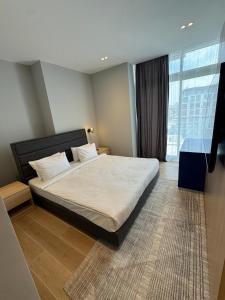 Кровать или кровати в номере The Polo Residence, Sea Breeze