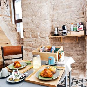 a table with two plates of food on it at B&B Palazzina Verde Stella in Palo del Colle +15 photos