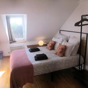 En eller flere senge i et værelse på Joli studio paisible proche stade de France