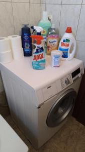 a washing machine with products on top of it at Francesco's Apartment-Chalkidiki in Flogita