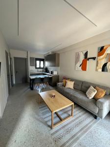 a living room with a couch and a table at Villa Agora in Nikiti