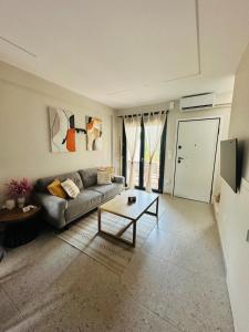 a living room with a couch and a coffee table at Villa Agora in Nikiti