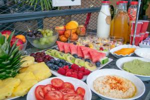a bunch of different types of fruit on a table at Niu Barcelona Hotel in Barcelona