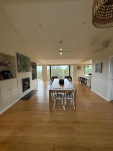 a large living room with a table and chairs at Ocean View Farm in Red Hill South