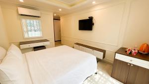 TV a/nebo společenská místnost v ubytování Elite SOFEA Saigon Hotel and Spa