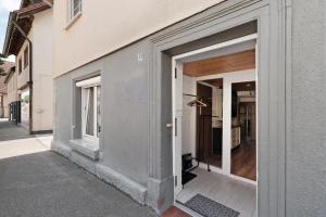 a building with two sliding doors on the side of it at Ferienwohnung Hagen in Pfalzgrafenweiler